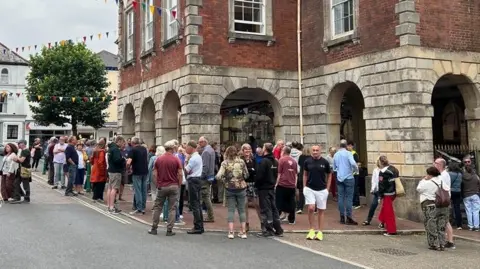 Crowds of people outside Great Torrington Town Hall