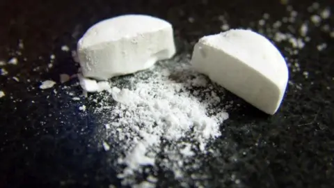 PA Media Generic image of a white broken tablet on a black background