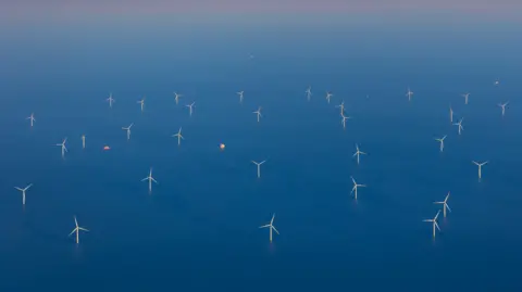 Getty Images Aerial view of a wind farm in the North Sea, showing turbines dotted into thedistance