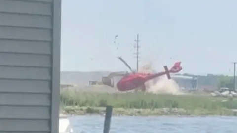 A helicopter flipped and crashed.