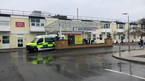 BBC Main entrance to Frimley Park Hospital, ambulance in doorway