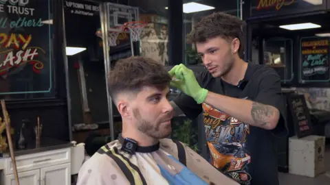man cutting hair 