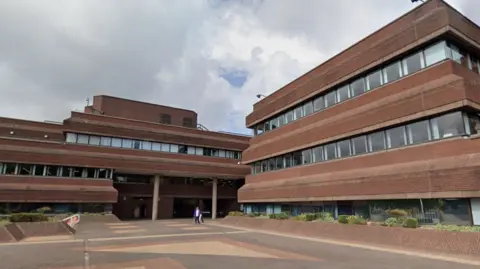 Google Maps General view of the City of Wolverhampton Council House. A large angular red brick building