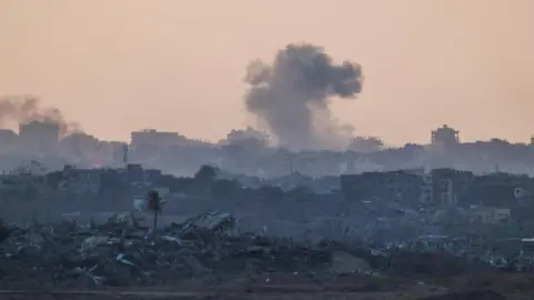 Reuters Smoke rising implicit    the bluish   Gaza skyline