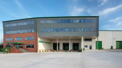 An exterior view of the existing Gompels Pharmacy building.