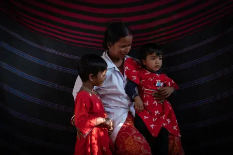 Swastik Pal Mangala Pradhan, whose son drowned in his home pond 16 years ago, now looks after children at a crèche in the Sundarbans