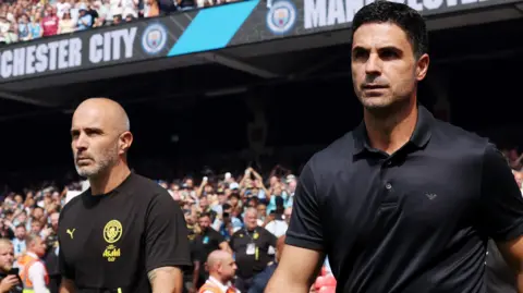 Mikel Arteta and Enzo Maresca walking out of the tunnel at Wembley Stadium