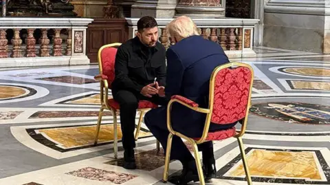 Ukrainian President Volodymyr Zelensky and US President Donald Trump speaking in St Peter's Basilica