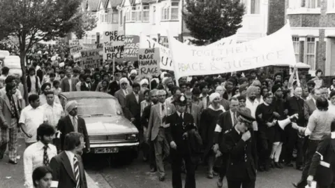 Virk Collection A black and white photograph of an anti-racism demonstration in Coventry.