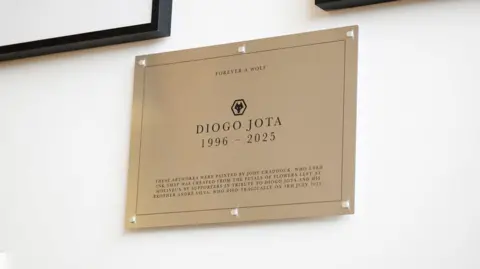Wolverhampton Wanderers A gold plaque with Diogo Jota and his birth and death dates engraved into it