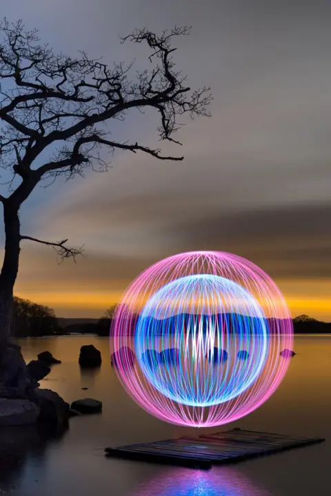 David Gilliver A purple/blue ball of light at night 