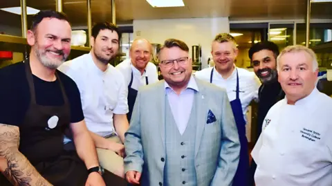 Kevin Byrne Matt Davies (centre) surrounded by some of Birmingham's best known chefs including Glynn Purnell and Aktar Islam