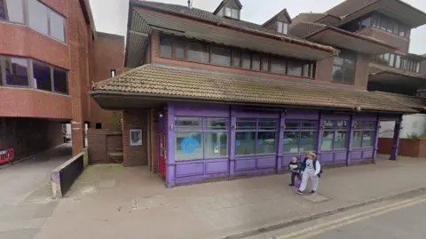 Google The purple frontage of the York Road Project's centre in Goldsworth Road, Woking.