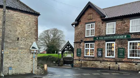 The junction of Stather Road, there is a pub and another building