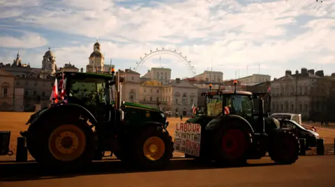 PA Media Farmers take part in a protest with their tractors in Whitehall, London on 26 November 2025.