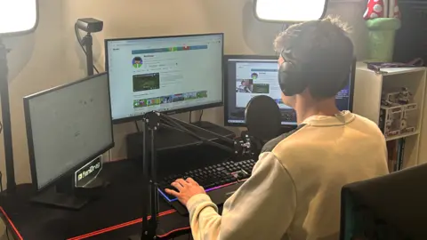 BBC Tom gaming at his desk 