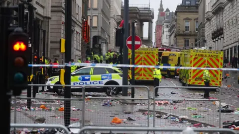 Police and emergency personnel dealing with an incident near the Liver Building in Liverpool during the Premier League winners' victory parade on 26 May 2025.