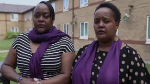 Irene Muthemba and Eddie's aunt, Jade Morris pictured outside a housing block