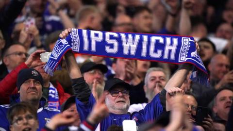 Fans celebrate during Ipswich's game against Coventry on 30 April 2024.