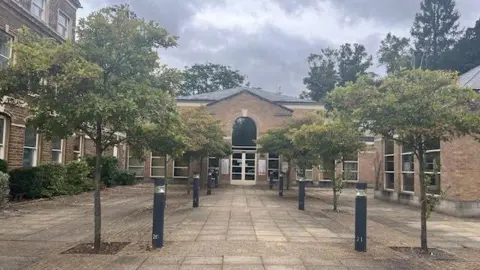 LDRS Entrance to Rutland County Council's headquarters with trees lining the route up to the door