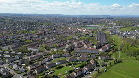 Getty Images An aerial image of the suburban area of Rutherglen, featuring low-rise housing stretching off towards the horizon