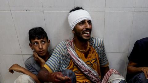 man and boy in hospital after israeli air strike