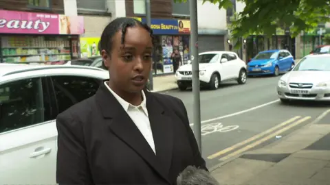 A woman tells a reporter she feels angry that black people are more likely to be stopped and searched