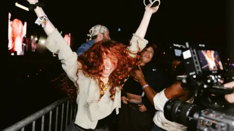 Chappell Roan dancing during Charli XCX's set