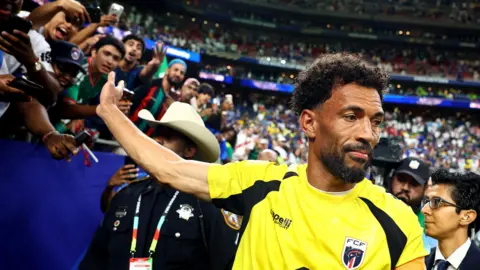 Cape Verde's Vozinha celebrates with fans after the match as Cape Verde qualify for the knockout stages of the World Cup 