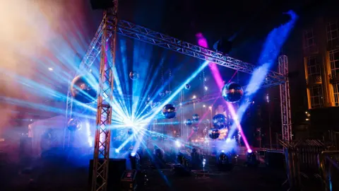 Tom Arran A large disco themed installation, with lasers, disco balls, and dry ice, based on one of the city centre's streets.