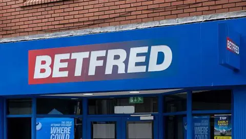 A Betfred shop with a blue shop front.