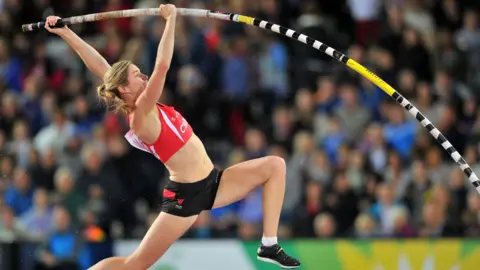 AFP via Getty Images Wales's Sally Peake competes in the final of the women's pole vault athletics event at Hampden Park during the 2014 Commonwealth Games in Glasgow, Scotland on August 2, 2014.