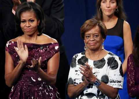 Michelle Obama and Marian Robinson clapping at an event