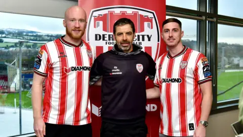 Liam Boyce [left] and Gavin Whyte [right] with Derry City boss Tiernan Lynch