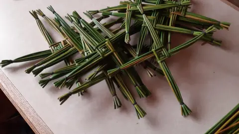 Sean Lipfird Some of the 130 St Brigid's crosses Sean Lipfird has been making for St Brigid's Day Masses.  The crosses are made of green rushes weaved together and secured with elastic bands.