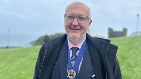 Dave Martin wearing the captain of the parish badge of office
