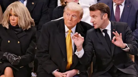 President Macron speaks to Donald Trump at the reopening of the cathedral