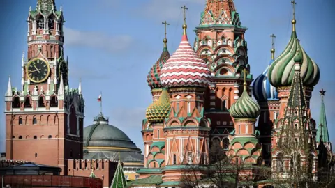 Getty Images The  Kremlin's Spasskaya tower and St. Basil's cathedral in downtown Moscow