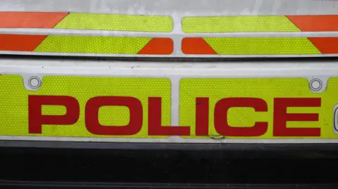 Police sign on the back of a vehicle
