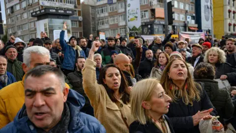 Getty Images Supporters of Mayor of Istanbul demonstrate in front of the Turkish police barricade in Istanbul March 19, 2025