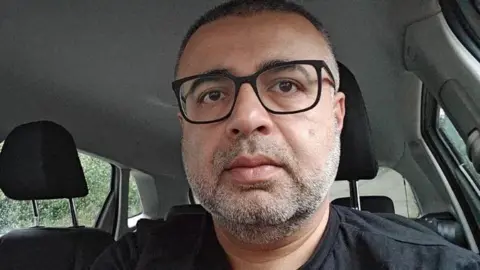 Ahmad Khan Ahmad Khan with black glasses and black top 