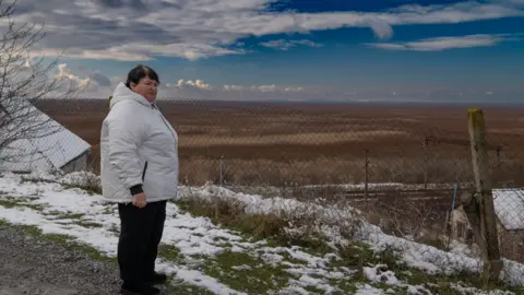 BBC/Matthew Goddard Lyudmyla looks over reservoir