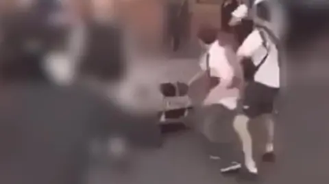 Humberside Police Footage from Humberside Police shown in court shows John Honey attacking a car in a racially aggravated incident. 