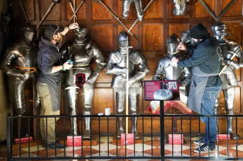 PA Media Staff polishing armour