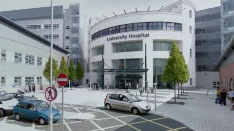 Google University Hospital Coventry a large white building with big windows and cars parked outside the front