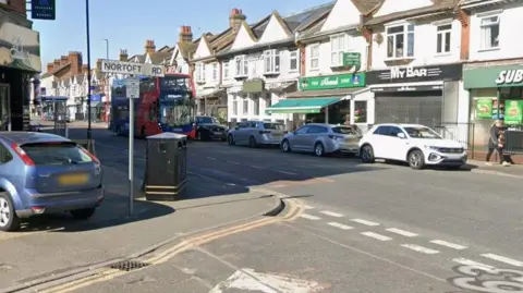 Street with shops underneath terrace.