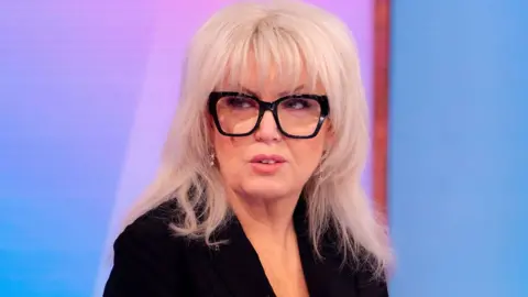 Baroness Helen Newlove wearing black-framed glasses and a black jacket as she appears on Loose Women in January 2025