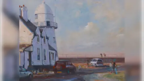 Stewart Taylor The painting shows the light house to the lef of the picture and the sea wall behind. Two people are leaning over the railings on the sea wall looking at the sea. Three cars are parked up on the side of the road.