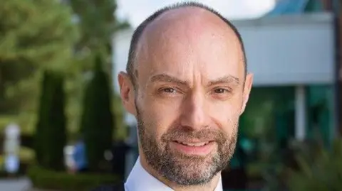 Lancashire Police Assistant Chief Constable Peter Lawson pictured smiling while in police uniform. He has a beard.