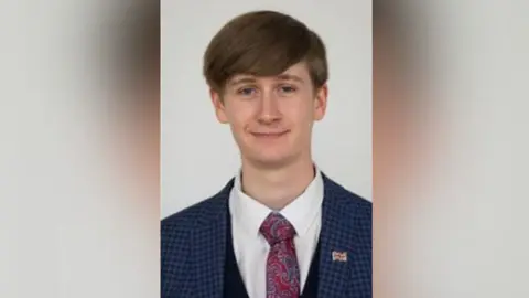 Leicestershire County Council A man in a jacket and tie 